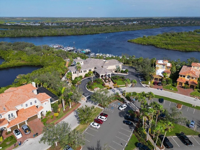 birds eye view of property featuring a residential view and a water view