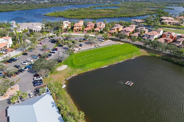 birds eye view of property with a residential view and a water view