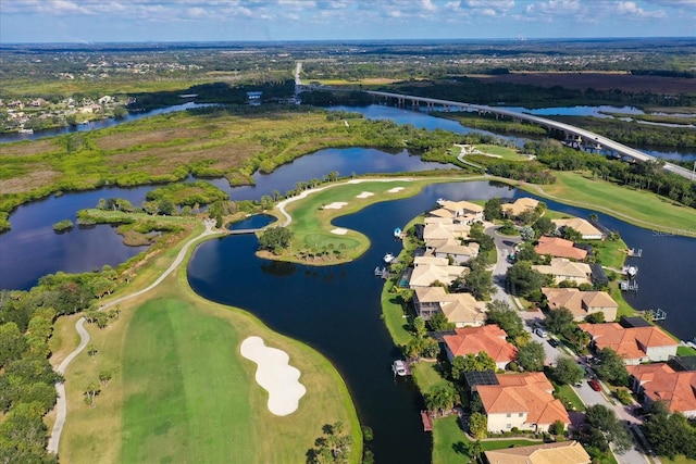 bird's eye view featuring view of golf course, a water view, and a residential view