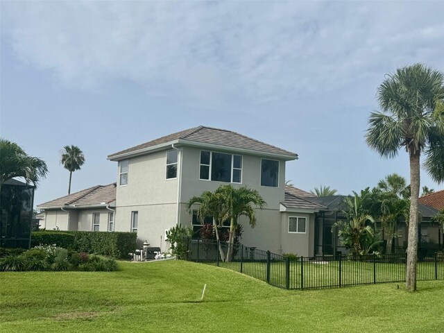 10509 Winding Stream Way, Bradenton, FL 34212 - back of house featuring stucco siding