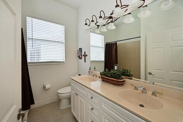 10509 Winding Stream Way, Bradenton, FL 34212 - full bath with toilet, tile patterned flooring, a shower with shower curtain, double vanity, and baseboards