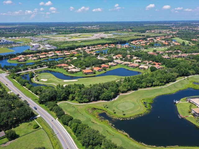 10509 Winding Stream Way, Bradenton, FL 34212 - aerial view of property's location featuring nearby suburban area, a local golf course, and a nearby body of water