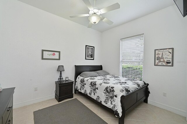 10509 Winding Stream Way, Bradenton, FL 34212 - bedroom with light tile patterned floors, baseboards, and ceiling fan