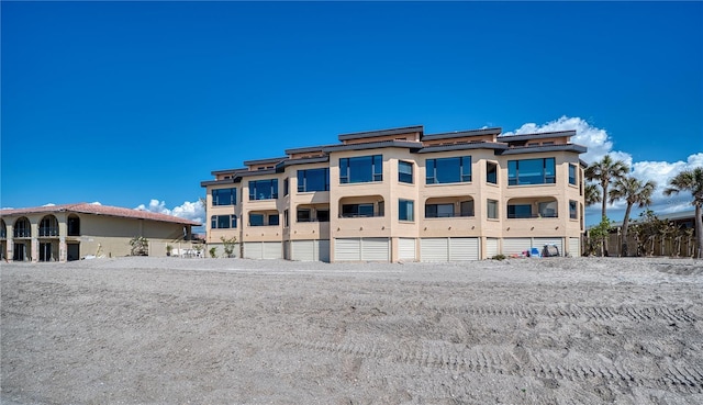 rear view of property with stucco siding