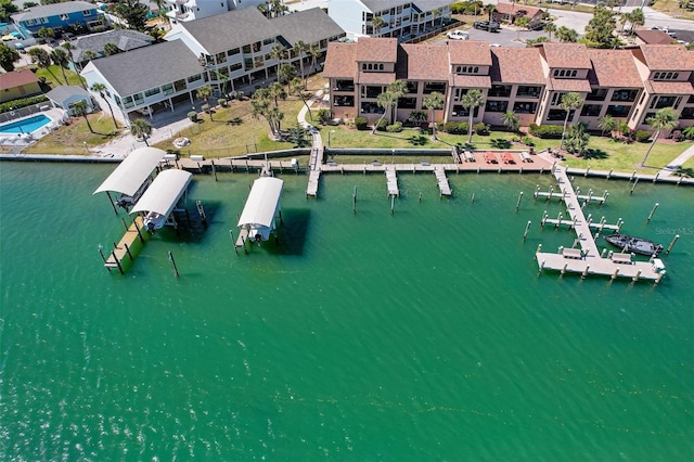 birds eye view of property with a water view and a residential view