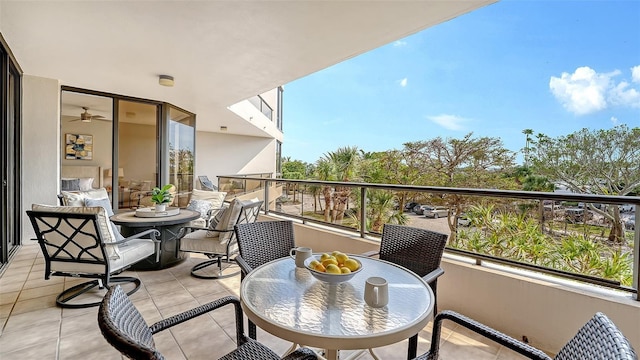 balcony with outdoor dining area and a sunroom