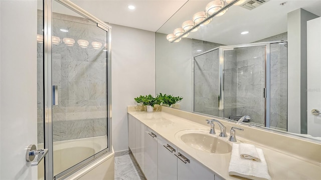 full bath with visible vents, vanity, and recessed lighting