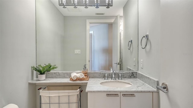 bathroom featuring visible vents and vanity