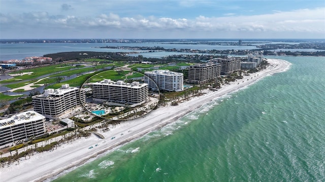 birds eye view of property with a view of city, a water view, and a view of the beach