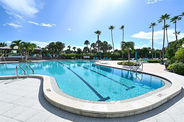 community pool with a patio area