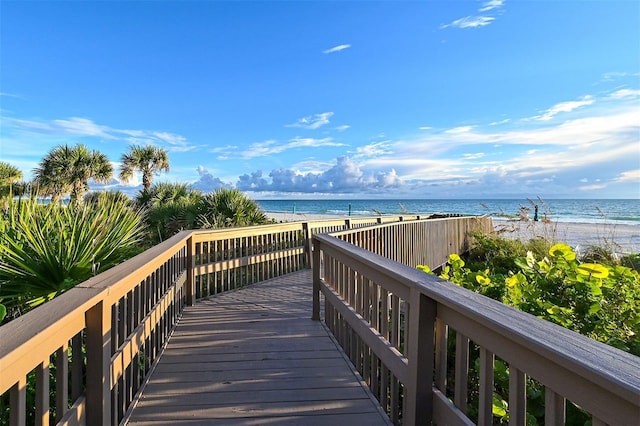 view of home's community featuring a beach view and a water view