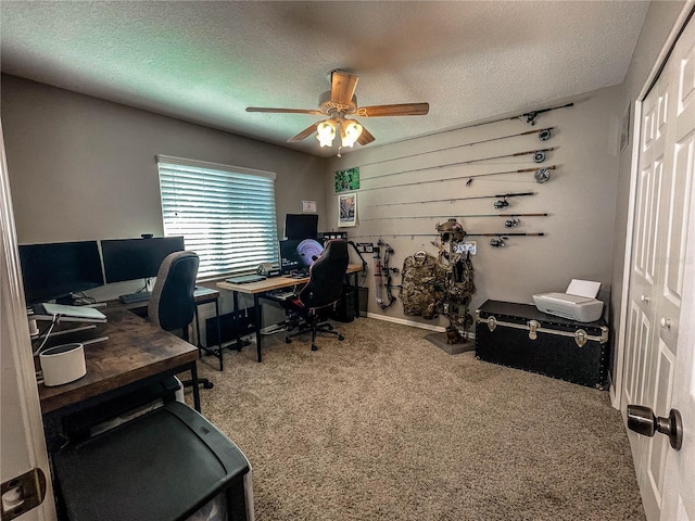 carpeted office space featuring wood walls, ceiling fan, and a textured ceiling