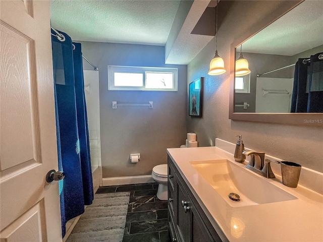 full bath featuring a shower with shower curtain, a textured ceiling, toilet, and vanity