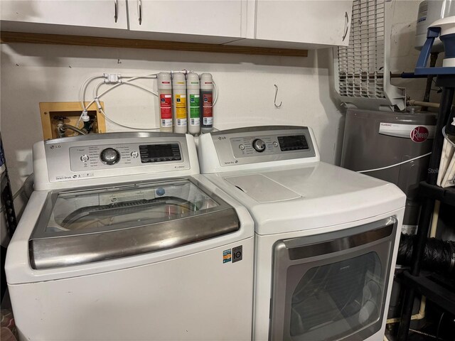 washroom featuring washer and dryer and cabinet space