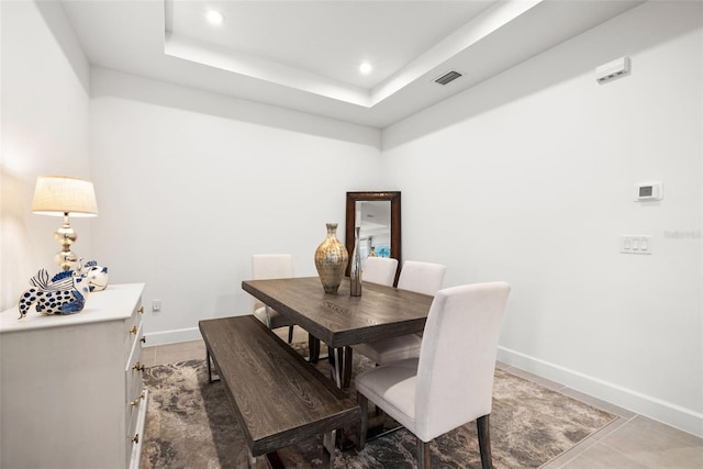 dining area featuring a tray ceiling
