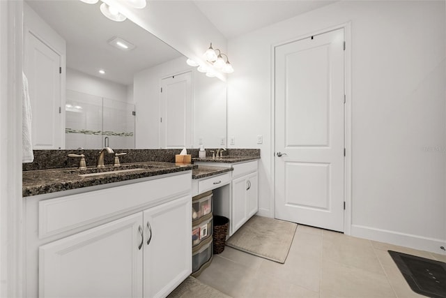 bathroom featuring vanity, an enclosed shower, and tile patterned flooring