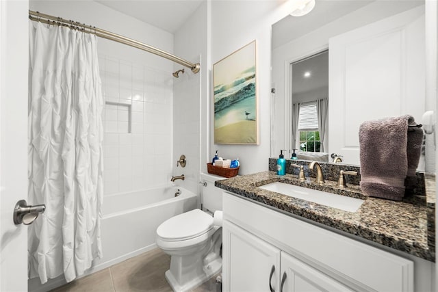 full bathroom with tile patterned floors, toilet, shower / bath combo, and vanity