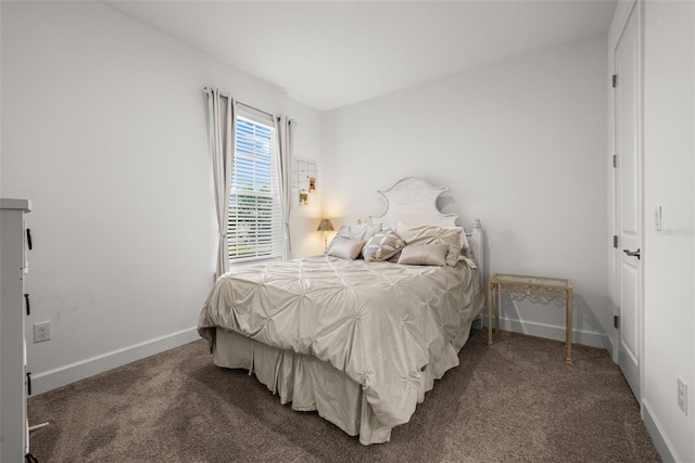 bedroom featuring dark colored carpet