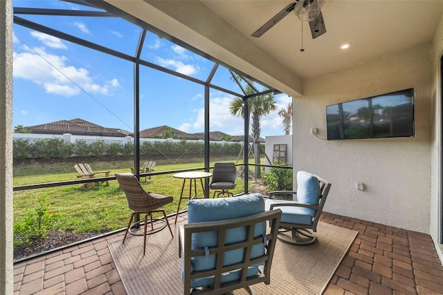 view of patio / terrace with a lanai and ceiling fan