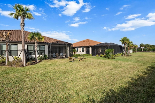 view of yard featuring glass enclosure