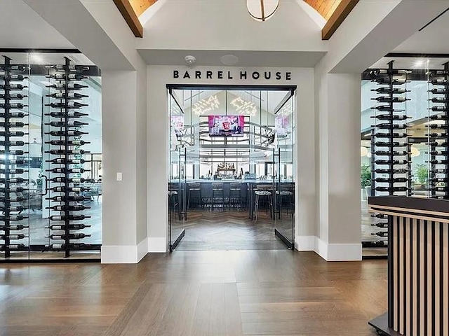 wine cellar featuring lofted ceiling with beams