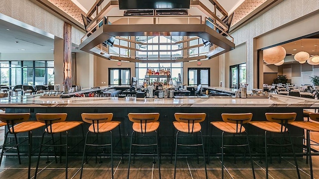 bar featuring a high ceiling