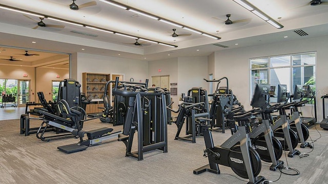exercise room with ceiling fan