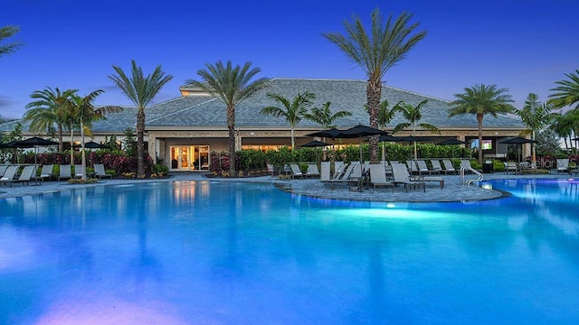 view of pool at dusk