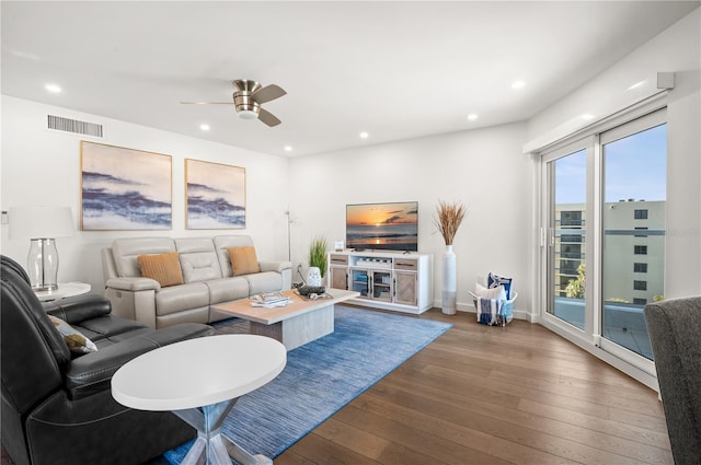 living area featuring dark wood finished floors, recessed lighting, visible vents, ceiling fan, and baseboards