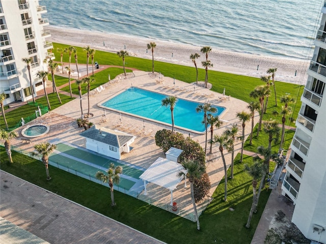 aerial view with a water view and a view of the beach