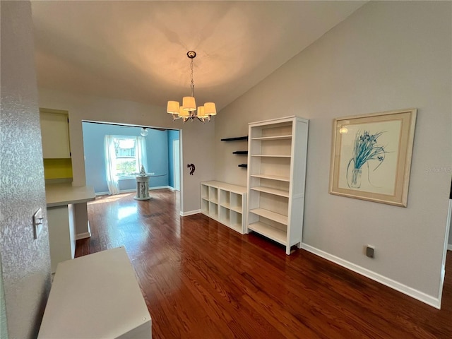 503 Philodendron, Punta Gorda, FL 33955 - dining room featuring vaulted ceiling, dark wood-style flooring, a chandelier, and baseboards