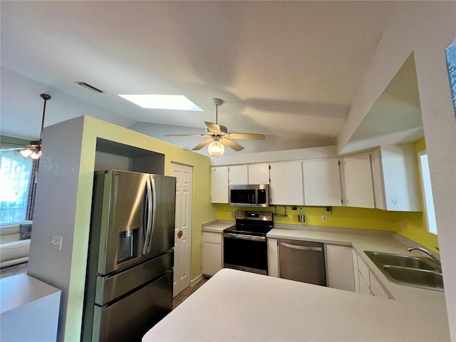 503 Philodendron, Punta Gorda, FL 33955 - kitchen with light countertops, visible vents, appliances with stainless steel finishes, white cabinets, and a sink