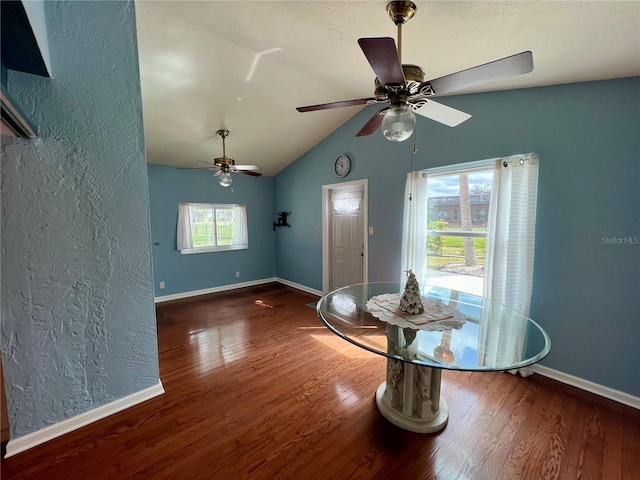 503 Philodendron, Punta Gorda, FL 33955 - unfurnished dining area featuring vaulted ceiling, a textured wall, dark wood finished floors, and baseboards
