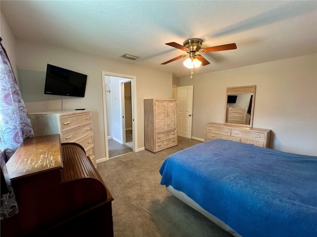 503 Philodendron, Punta Gorda, FL 33955 - bedroom featuring a textured ceiling, dark carpet, visible vents, and baseboards