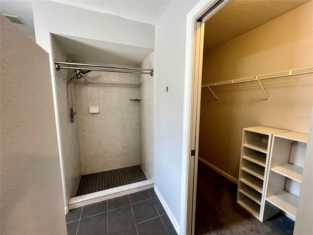 503 Philodendron, Punta Gorda, FL 33955 - walk in closet featuring dark tile patterned flooring and visible vents