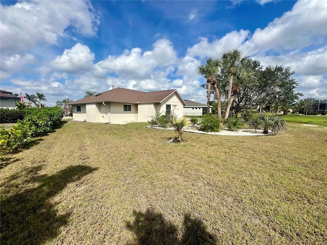 503 Philodendron, Punta Gorda, FL 33955 - back of property with stucco siding and a yard