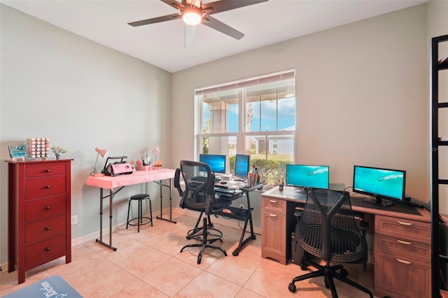 office with baseboards, a ceiling fan, and light tile patterned flooring