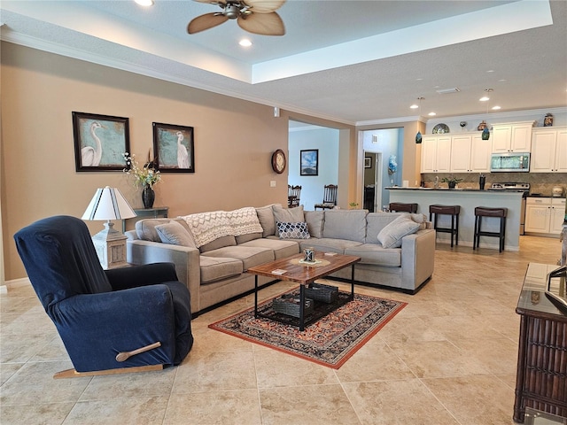 16422 Rivers Reach Blvd, Parrish, FL 34219 - living area with light tile patterned floors, ceiling fan, ornamental molding, and recessed lighting