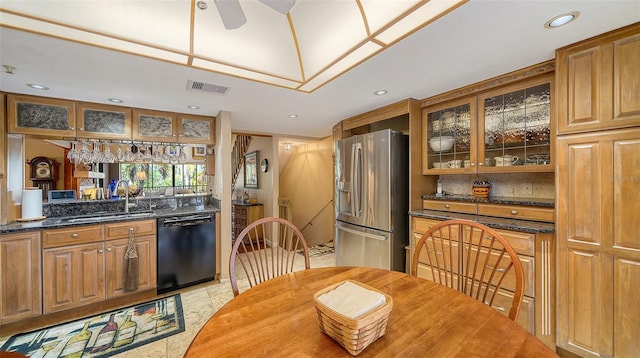 kitchen with glass insert cabinets, black dishwasher, a sink, and stainless steel refrigerator with ice dispenser