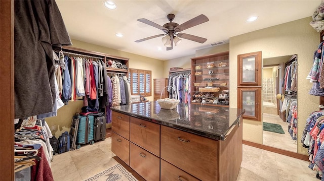 walk in closet featuring visible vents and ceiling fan