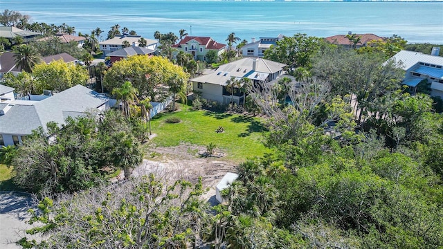 birds eye view of property with a water view and a residential view