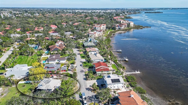 bird's eye view featuring a water view and a residential view