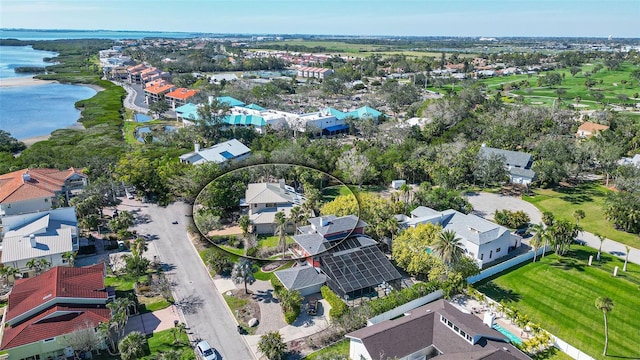 birds eye view of property with a water view and a residential view