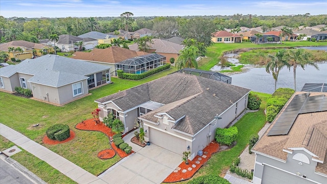 aerial view featuring a water view and a residential view