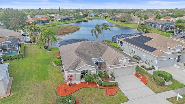 birds eye view of property featuring a water view and a residential view