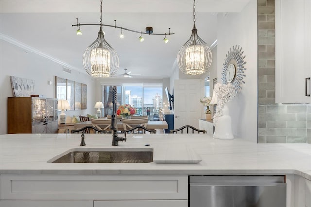 kitchen featuring white cabinetry, decorative backsplash, a wealth of natural light, and open floor plan