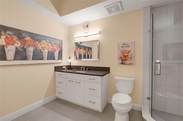 bathroom with visible vents, toilet, a shower stall, vanity, and baseboards