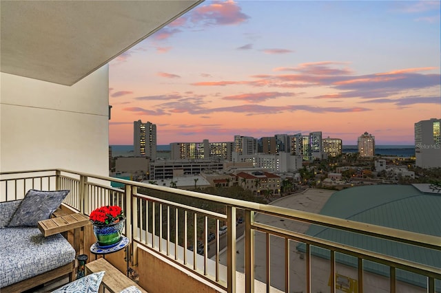 balcony at dusk with a city view