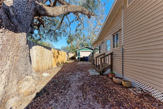 view of yard with an outbuilding and a garage