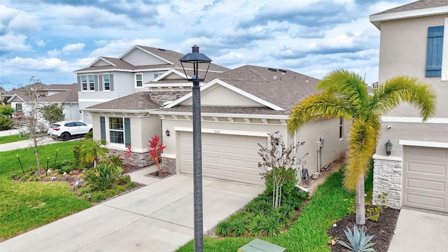 view of front of property featuring an attached garage, stone siding, driveway, stucco siding, and a shingled roof